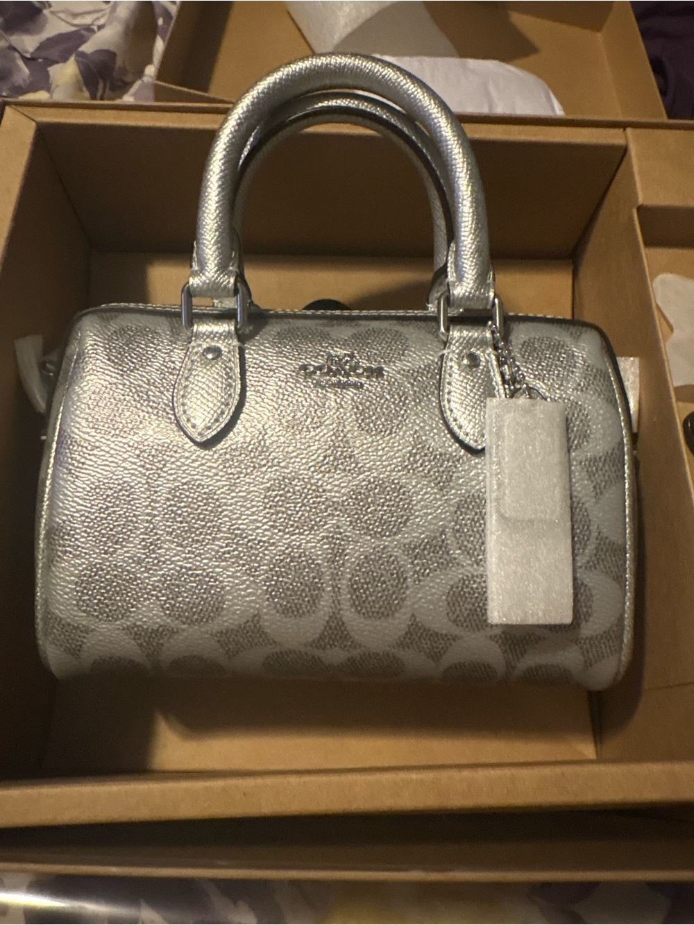 Coach Metallic Silver Signature mini Rowan with star charm